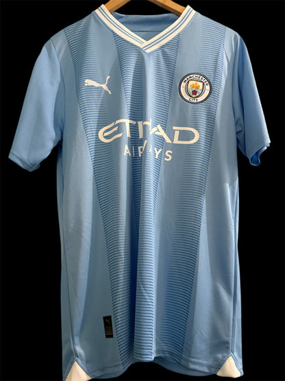 Manchester City 2023-2024 Home Shirt signed by Rico Lewis (COA)